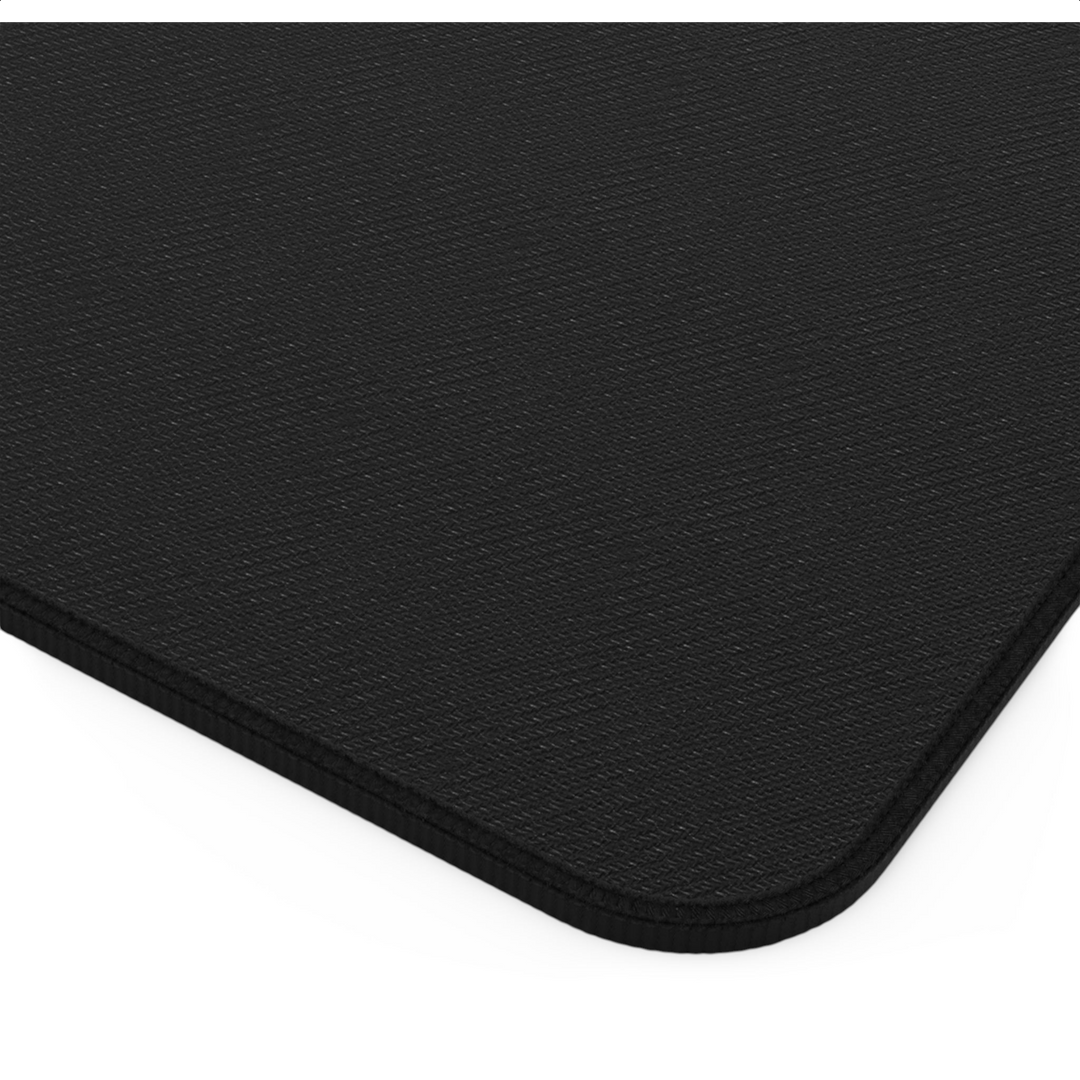 Sunday Theory black neoprene desk mat with a textured surface and durable hemmed edges for workspace organization