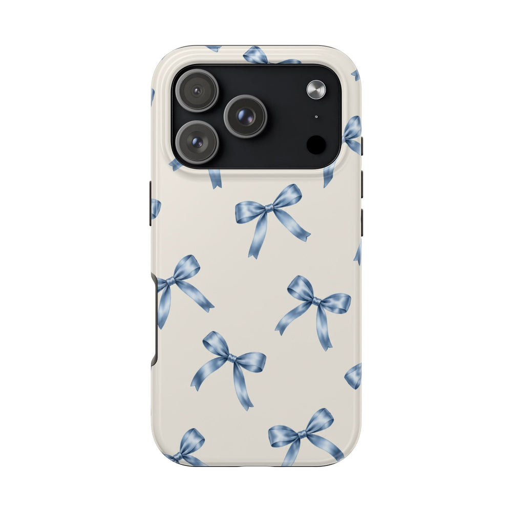 Sunday Theory protective phone case with a cream background and delicate watercolor blue bow pattern, glossy finish.