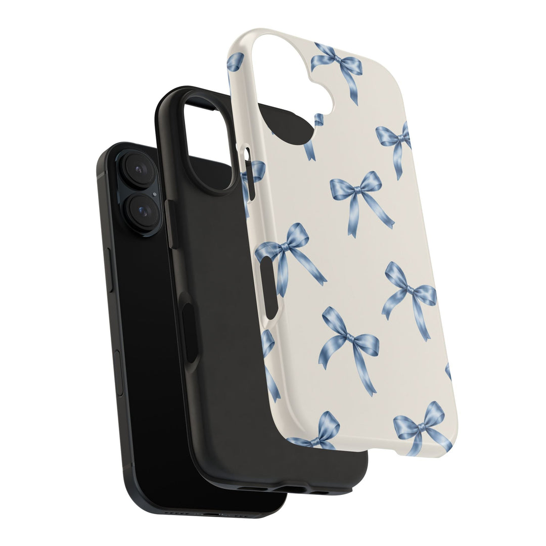 Sunday Theory protective phone case with cream background and blue watercolor bow pattern and black rubber liner