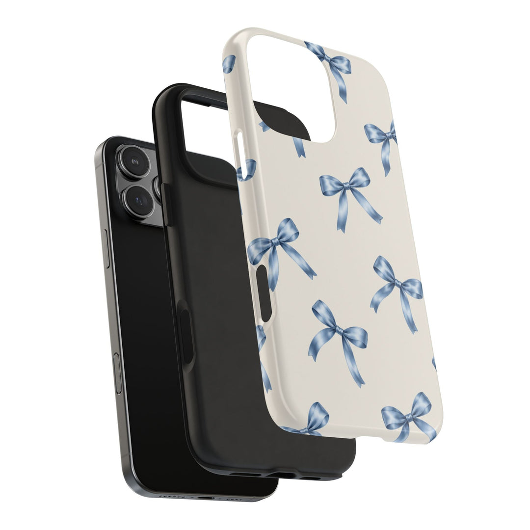 Sunday Theory protective phone case with cream background and blue watercolor bow pattern, showing two-piece design.