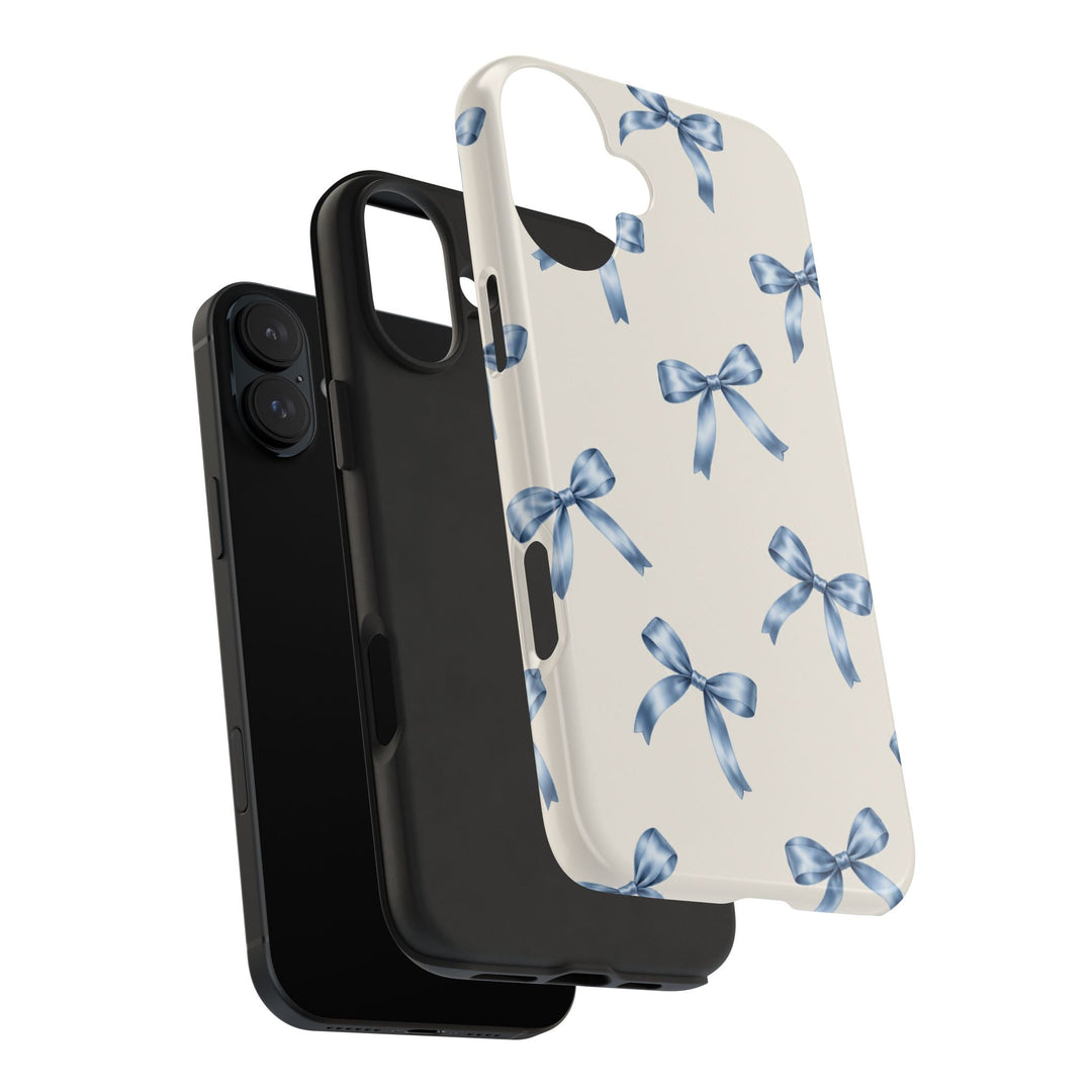 Sunday Theory protective phone case with a cream background and watercolor blue bow pattern, showing two-piece design.
