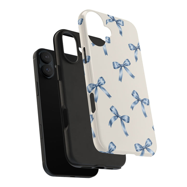 Sunday Theory protective phone case with a cream background and watercolor blue bow pattern, showing two-piece design.