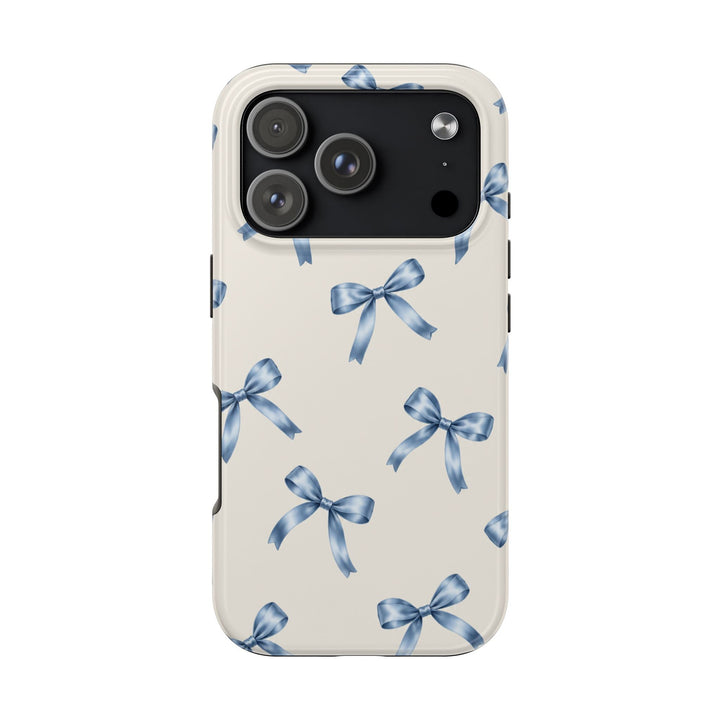 Sunday Theory protective phone case with a cream background and watercolor blue ribbon bow pattern, glossy finish.