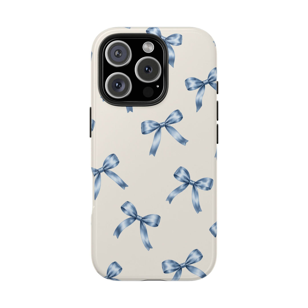 Sunday Theory protective phone case with a cream background and watercolor blue ribbon bow pattern, glossy finish.