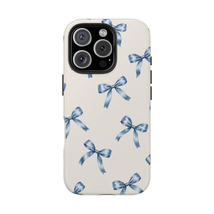 Sunday Theory protective phone case with a cream background and watercolor blue ribbon bow pattern, glossy finish.