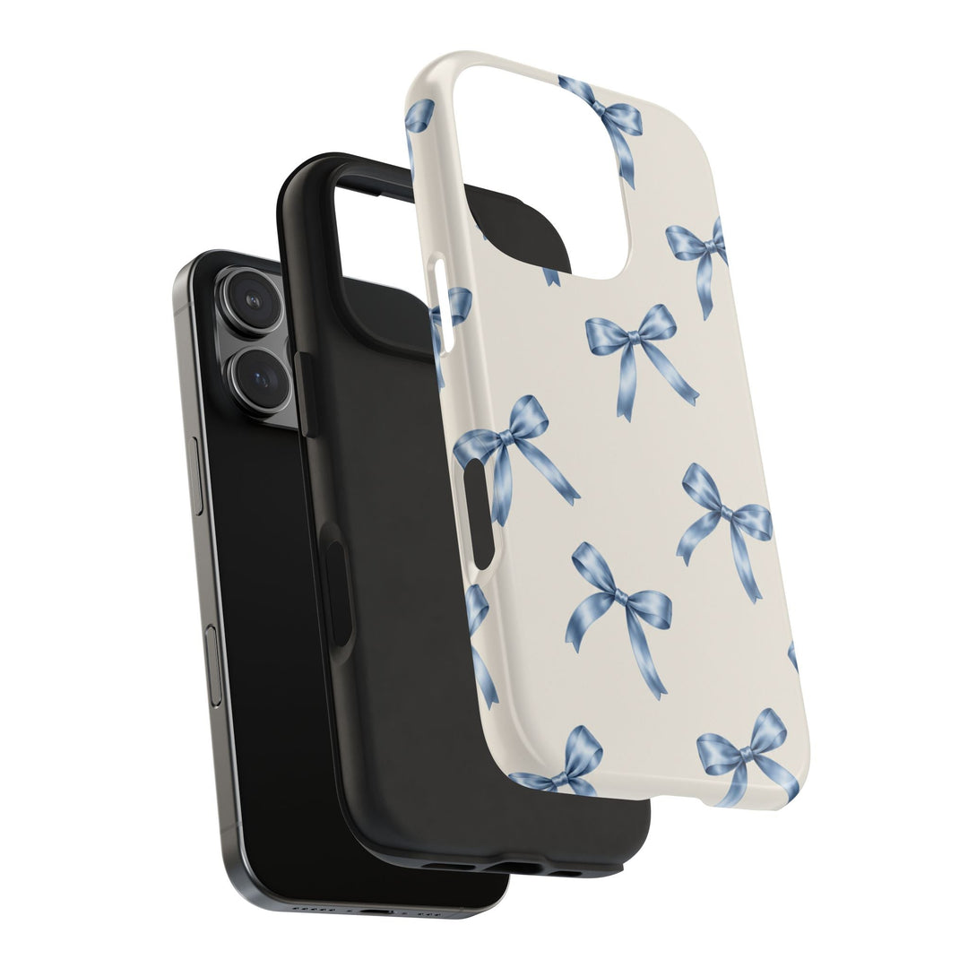 Sunday Theory protective phone case featuring a cream background with watercolor blue bows and a black rubber liner.