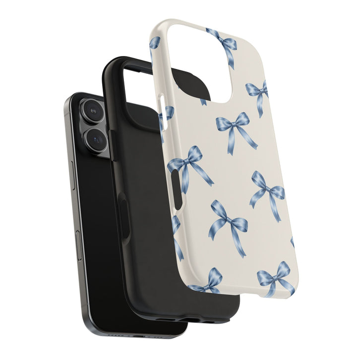 Sunday Theory protective phone case featuring a cream background with watercolor blue bows and a black rubber liner.