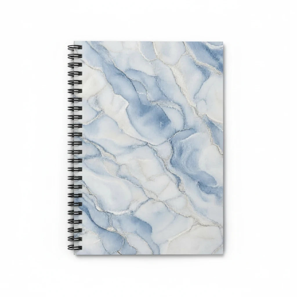 Sunday Theory blue marble spiral notebook with gold-vein accents and black metal binding on a white background.