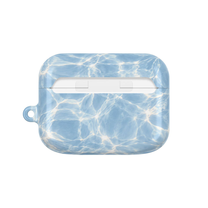 Sunday Theory glossy blue water ripple pattern polycarbonate AirPod case with a side loop for a carabiner.