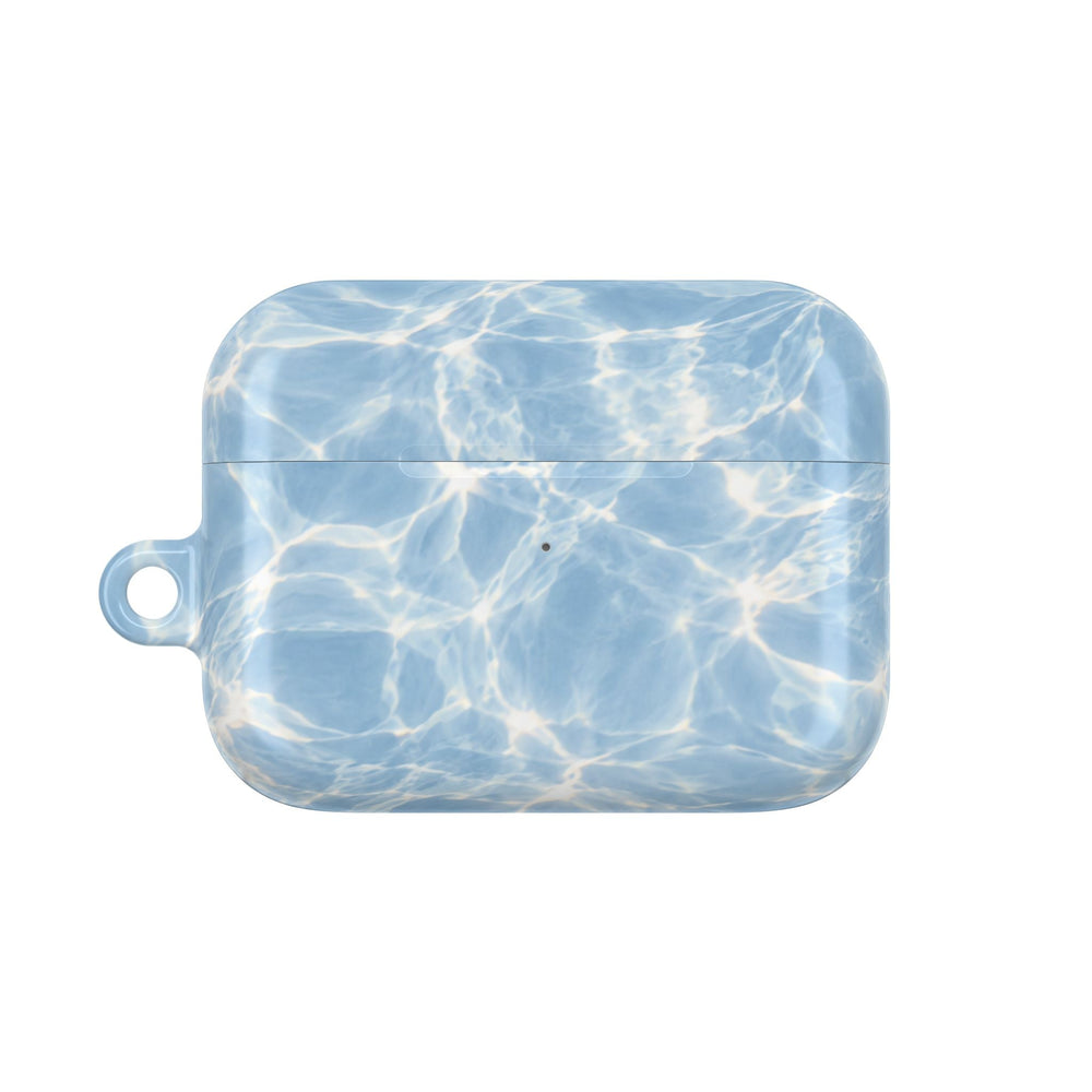 Sunday Theory glossy blue polycarbonate AirPod case with a summery water ripple pattern and side attachment loop