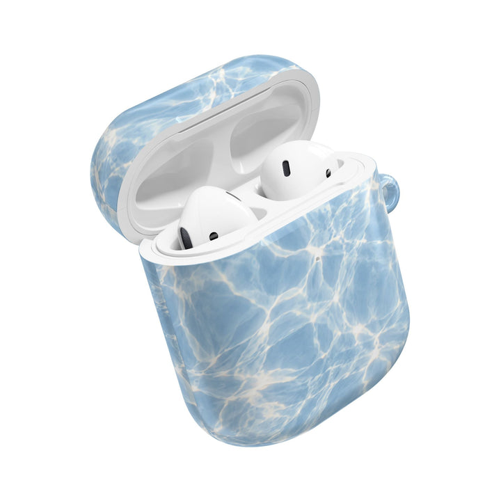 Sunday Theory glossy blue water ripple pattern polycarbonate AirPod case with white earbuds inside