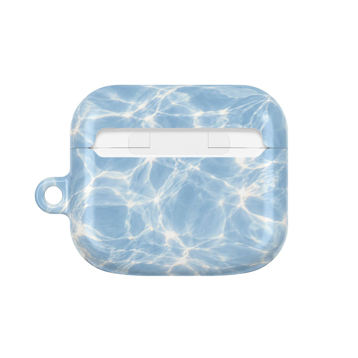Sunday Theory glossy blue water ripple pattern polycarbonate AirPod case with a side loop for a carabiner.