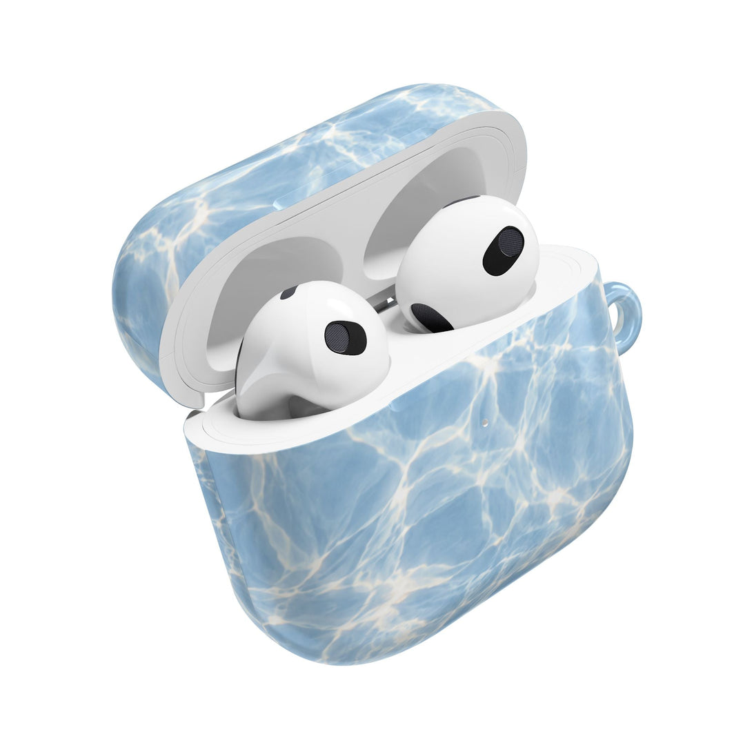 Sunday Theory blue water ripple patterned polycarbonate AirPod case with a glossy finish and open lid