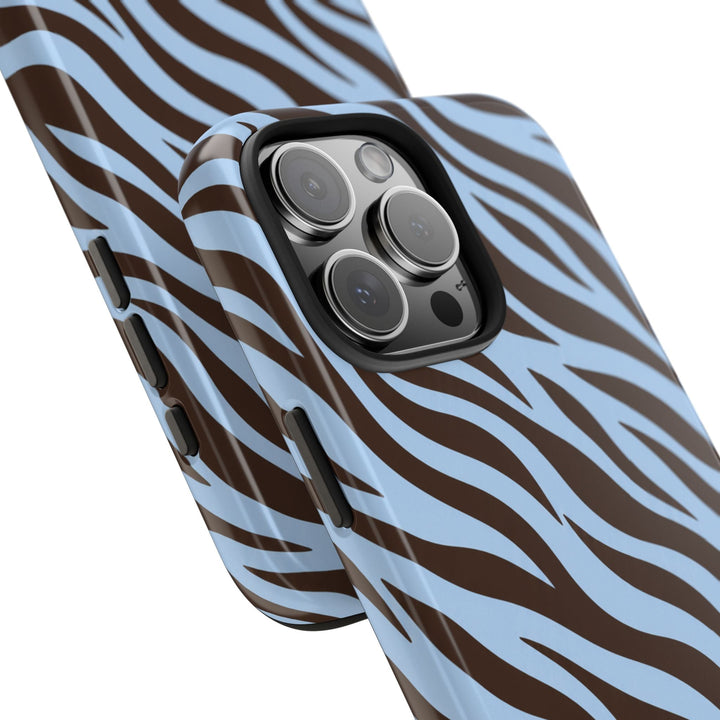 Sunday Theory blue and brown zebra print protective phone case with a glossy finish and black camera bezel cutout.