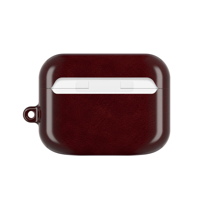 Sunday Theory burgundy glossy polycarbonate AirPod case with a side keyring loop for secure attachment