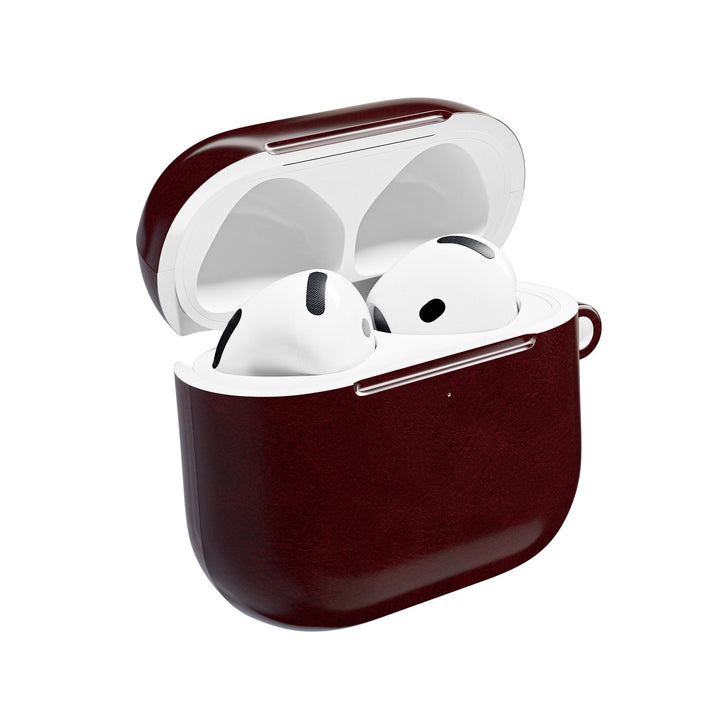 Sunday Theory burgundy polycarbonate AirPod case with a slim gloss finish and integrated keyring loop