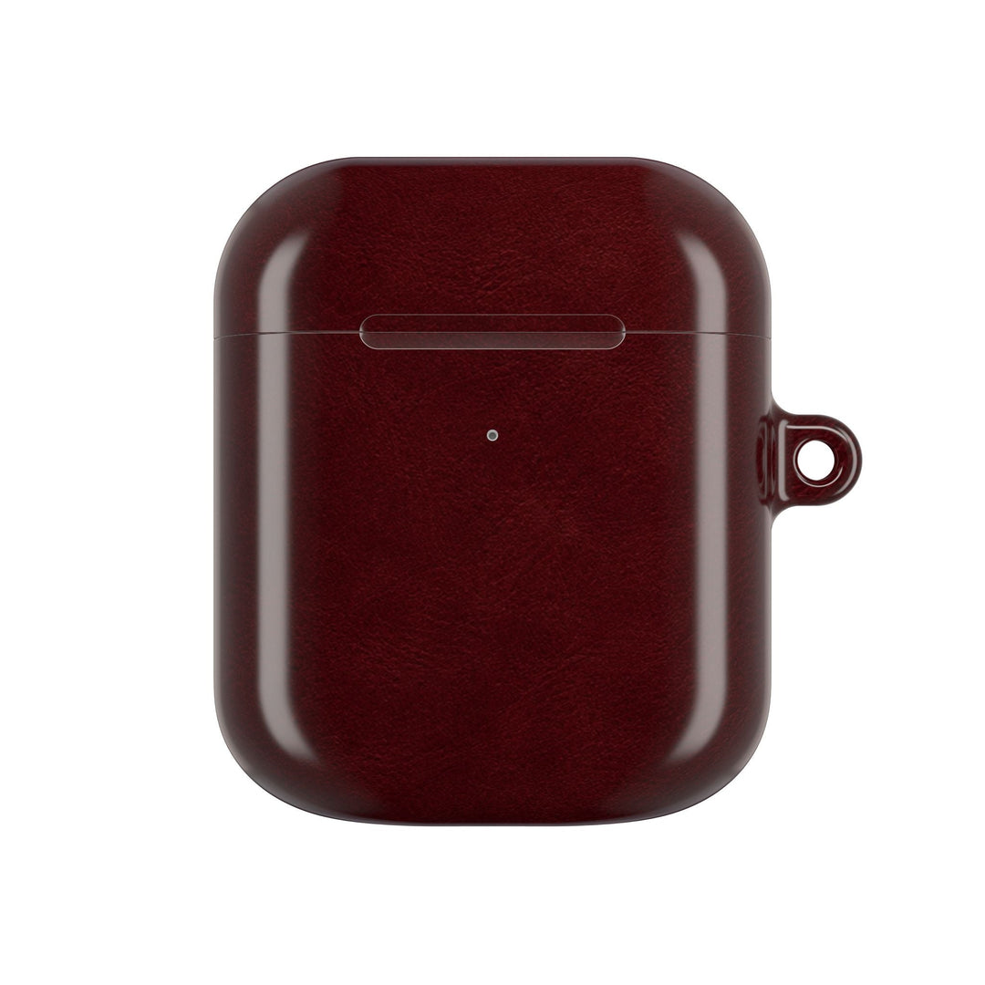 Sunday Theory burgundy glossy polycarbonate AirPod case with a side attachment loop for a carabiner