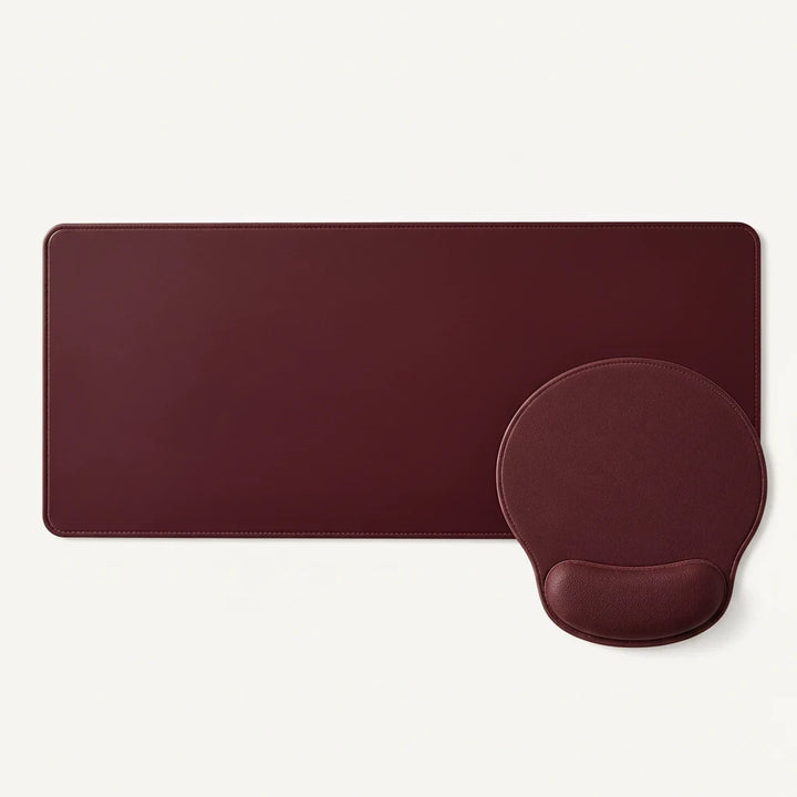 Sunday Theory burgundy desk mat and ergonomic mouse pad with memory foam wrist rest for a professional workspace