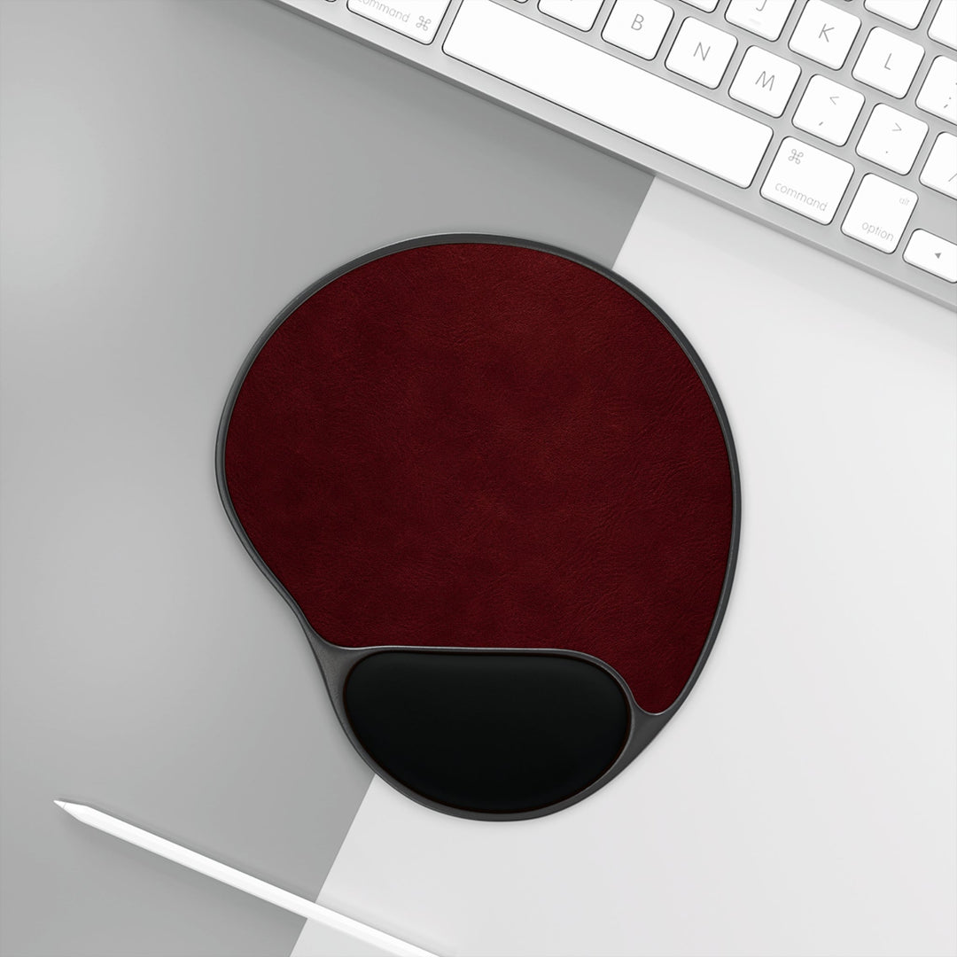 Sunday Theory burgundy ergonomic mouse pad with black memory foam wrist rest on a modern desk setup