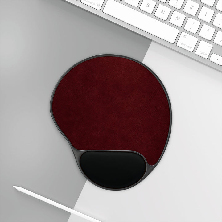 Sunday Theory burgundy ergonomic mouse pad with black memory foam wrist rest on a modern desk setup