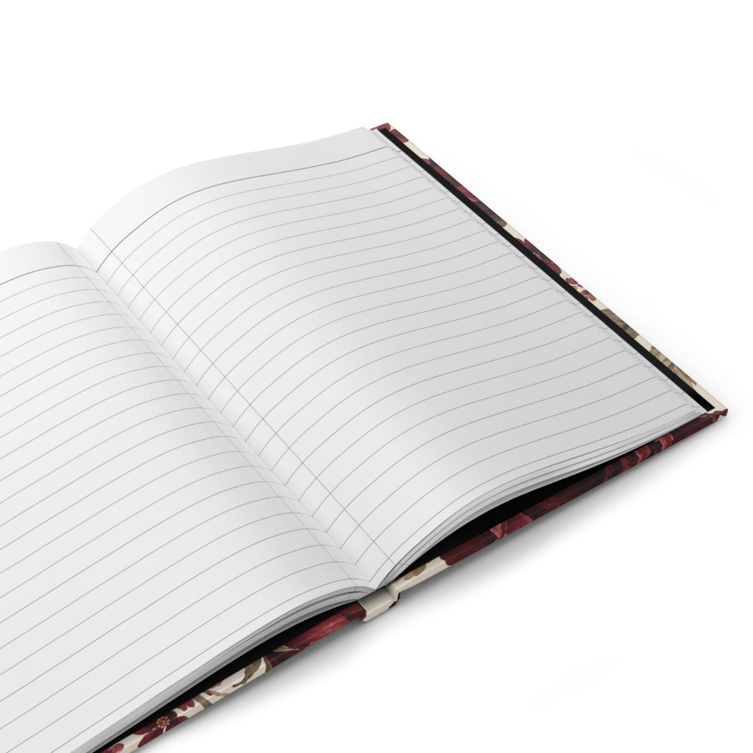 Sunday Theory burgundy floral hardcover journal open to lined pages with a flat-lay sewn binding design.