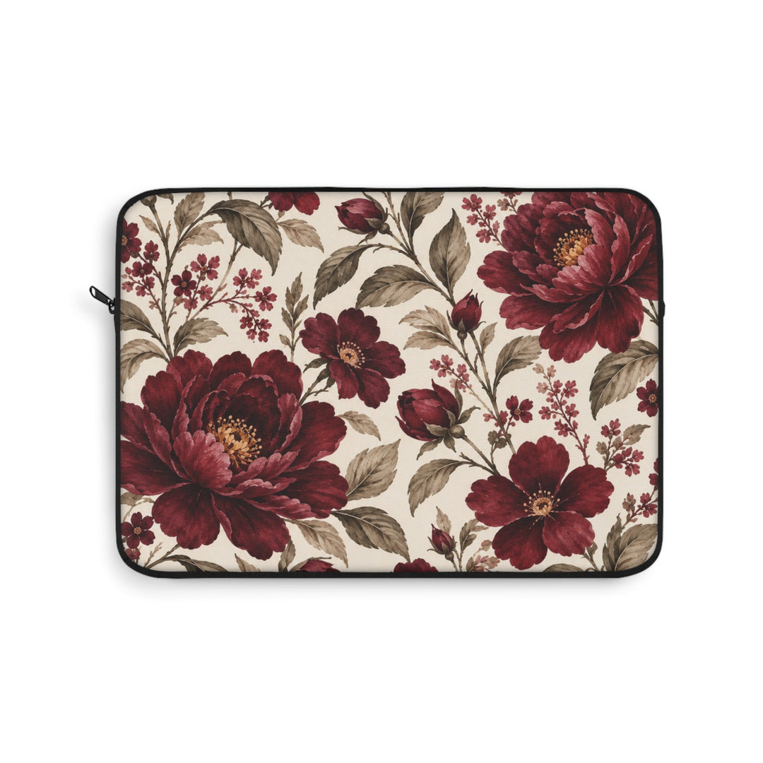 Sunday Theory laptop sleeve featuring a vintage burgundy peony floral print on a cream background with black trim.