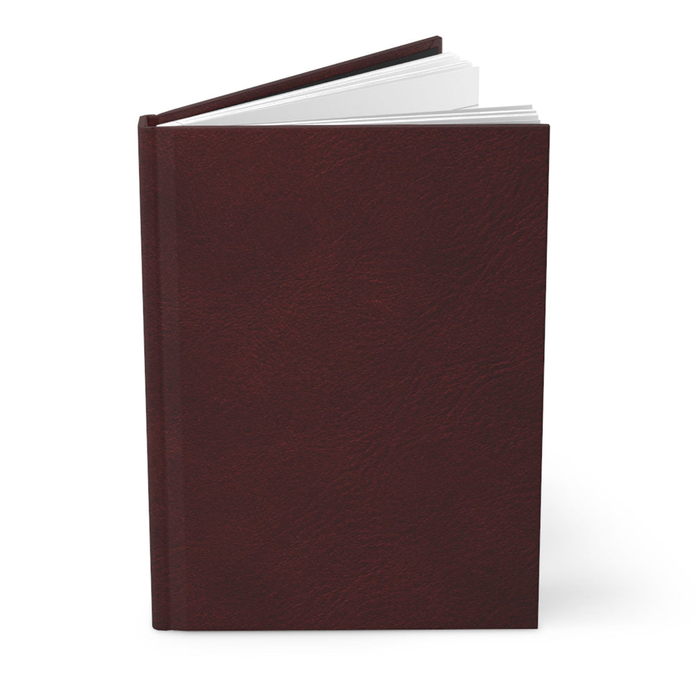 Sunday Theory burgundy hardcover journal with a matte finish and sewn binding, shown slightly open.