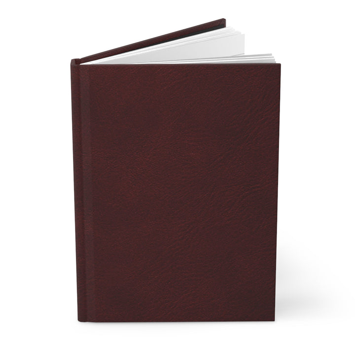 Sunday Theory burgundy hardcover journal with a matte finish and sewn binding, shown slightly open.