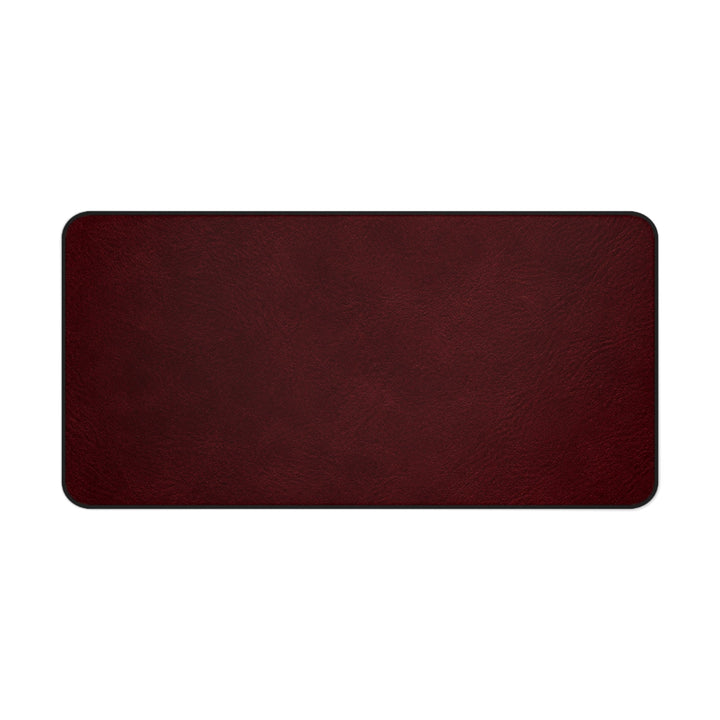 Sunday Theory burgundy leather-look desk mat with a smooth texture and black stitched edges.