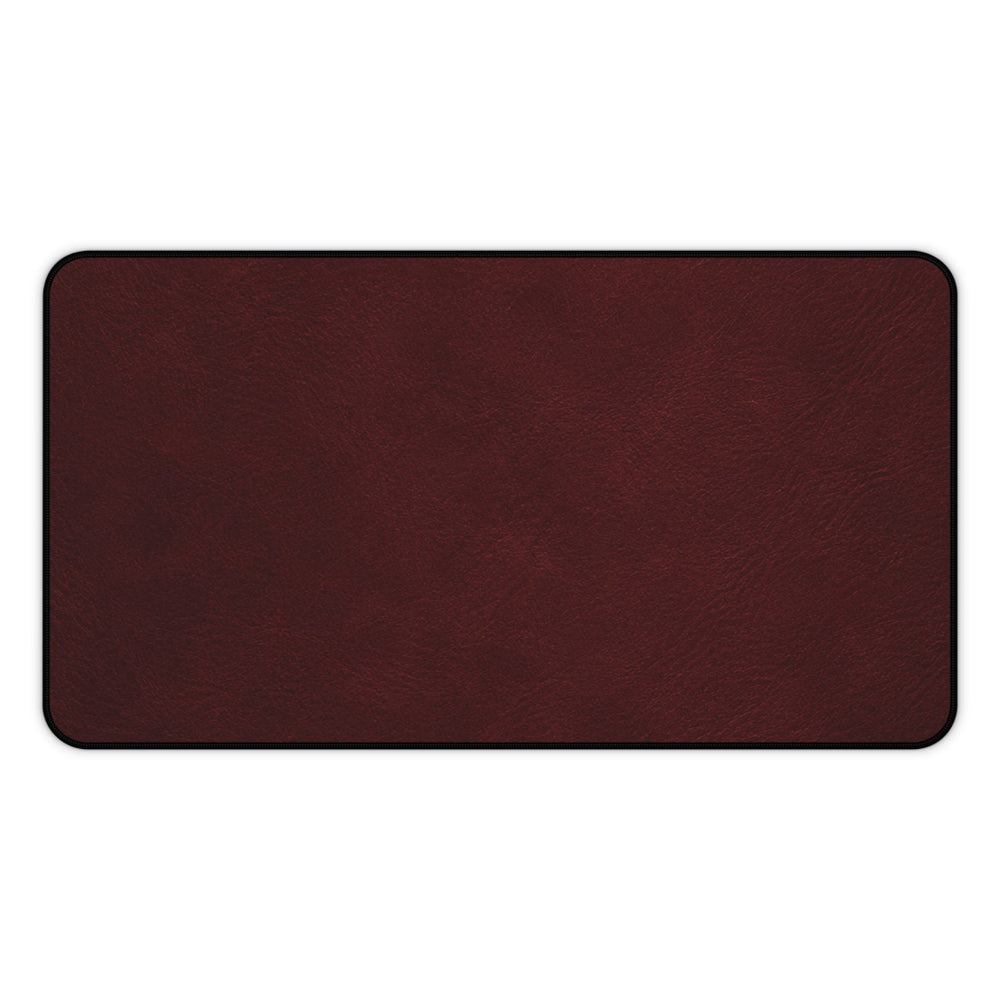 Sunday Theory burgundy neoprene desk mat with a smooth leather-look surface and durable hemmed edges.