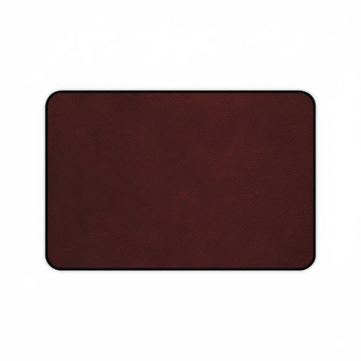 Sunday Theory burgundy leather-look neoprene desk mat with hemmed edges and a smooth, anti-slip surface.