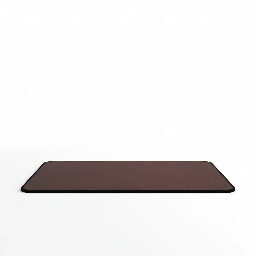 Sunday Theory burgundy neoprene desk mat with a smooth leather-look surface and durable hemmed edges.