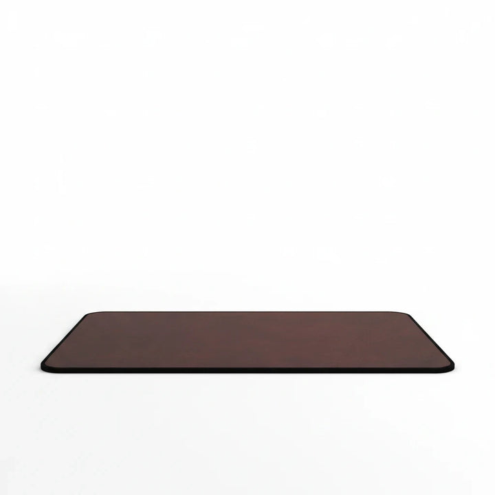 Sunday Theory burgundy neoprene desk mat with a smooth leather-look surface and durable hemmed edges.