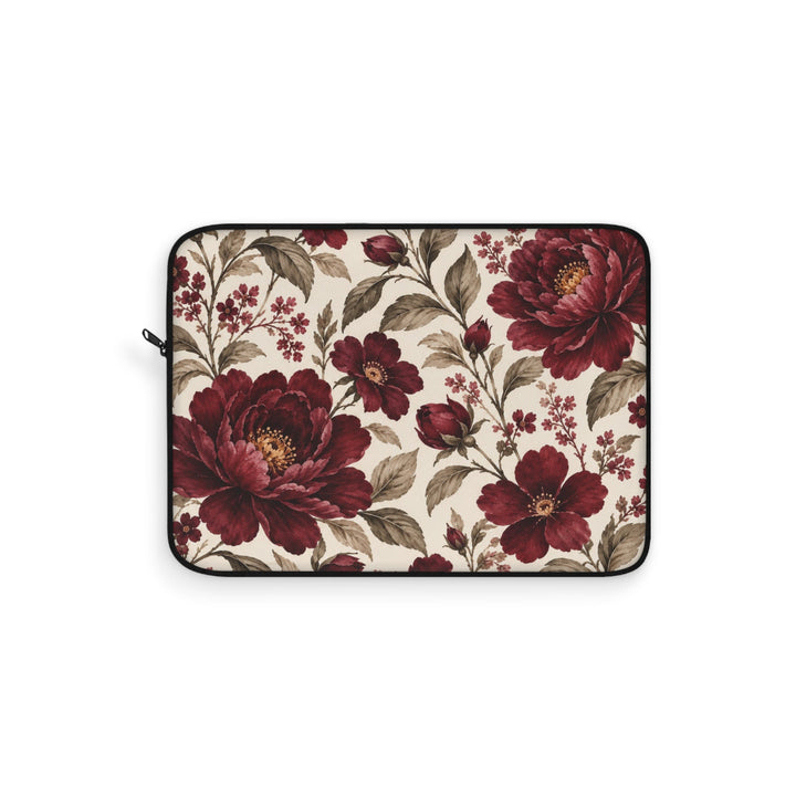 Sunday Theory laptop sleeve featuring a vintage burgundy peony floral print on a cream background with black trim.