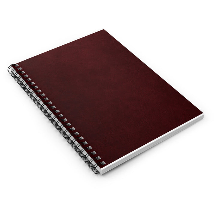Sunday Theory burgundy spiral notebook with a textured cover and black metal binding, perfect for daily planning.