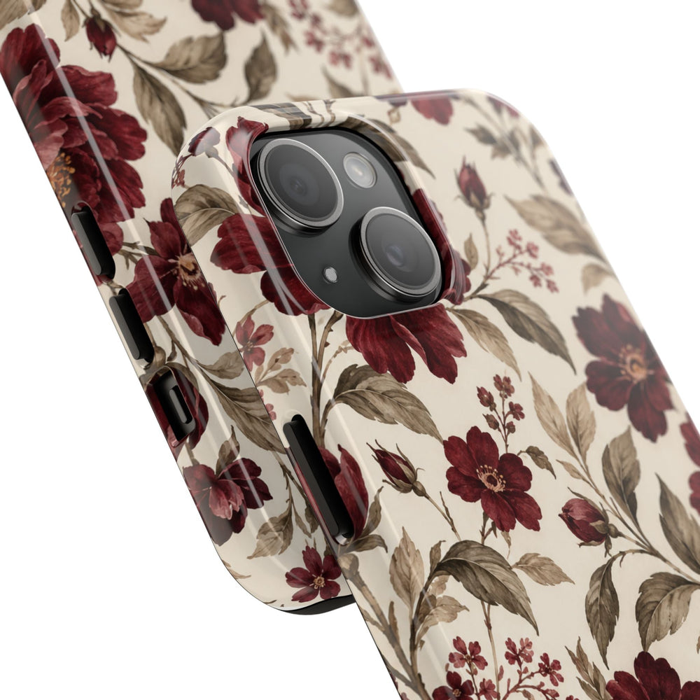 Sunday Theory floral phone case with vintage burgundy peonies and olive leaves on a cream background, glossy finish.