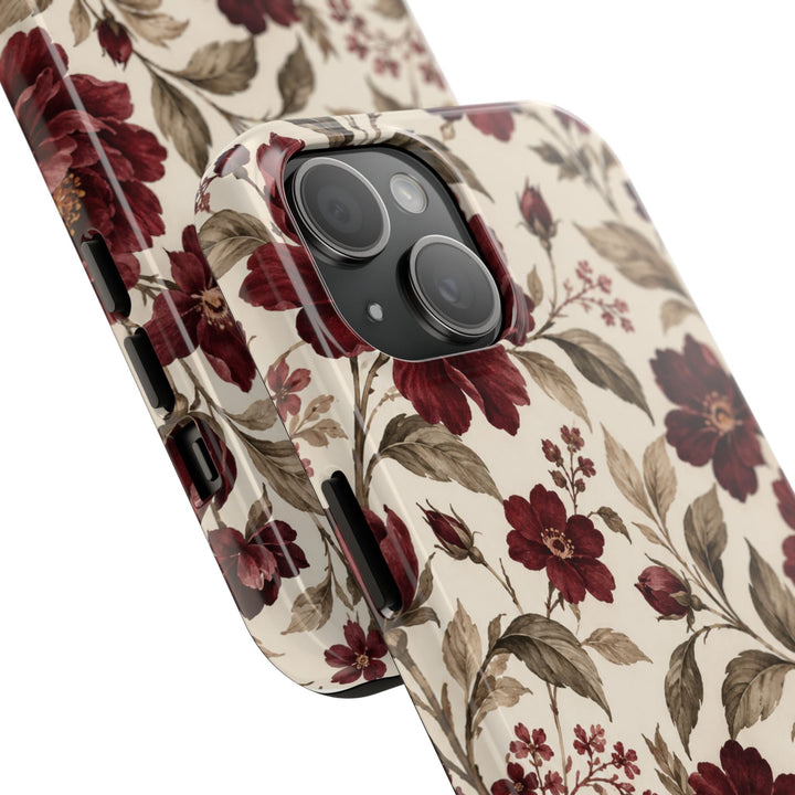 Sunday Theory floral phone case with vintage burgundy peonies and olive leaves on a cream background, glossy finish.