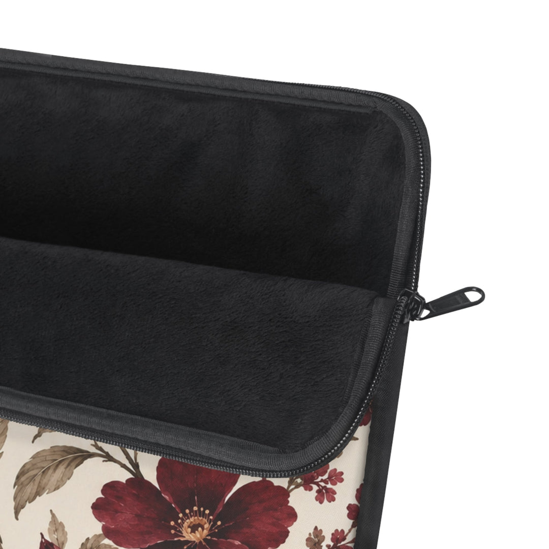 Sunday Theory laptop sleeve with burgundy peony floral print, cream background, and plush black fleece interior.