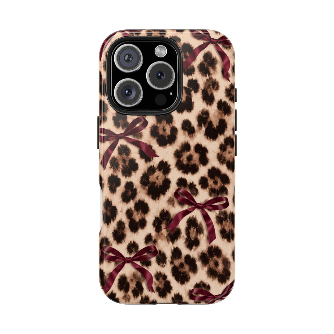 Sunday Theory leopard print phone case with burgundy bows, featuring a glossy, impact-resistant protective shell.