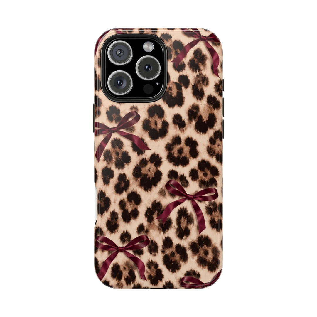 Sunday Theory leopard print phone case with burgundy bows, featuring a glossy, impact-resistant protective shell.