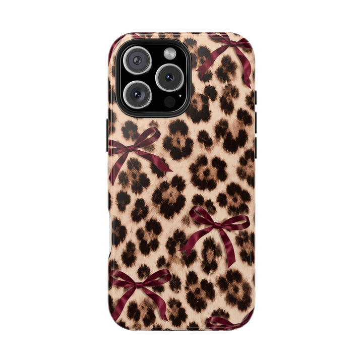 Sunday Theory leopard print phone case with burgundy bows, featuring a glossy, impact-resistant protective shell.