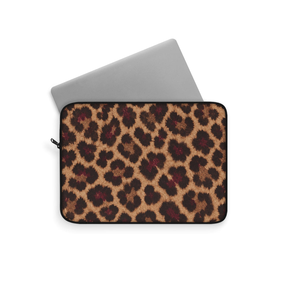 Sunday Theory leopard print laptop sleeve with a silver laptop partially inserted, featuring a plush fleece interior.