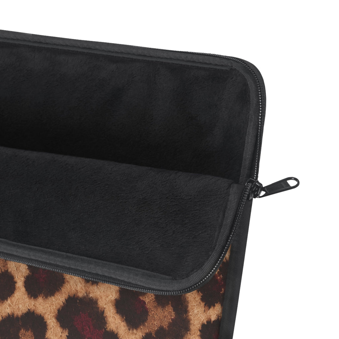 Sunday Theory leopard print laptop sleeve with a plush black fleece interior and a smooth nylon zipper closure.