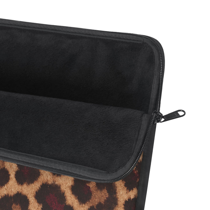 Sunday Theory leopard print laptop sleeve with a plush black fleece interior and a smooth nylon zipper closure.