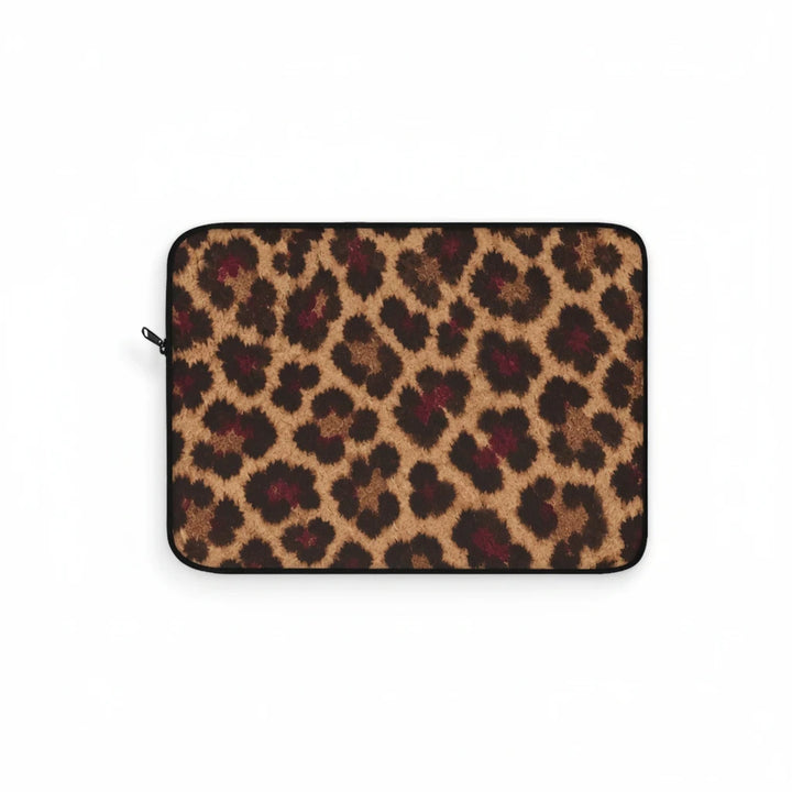 Sunday Theory leopard print laptop sleeve with tan and brown spots and a smooth black zipper on a white background.