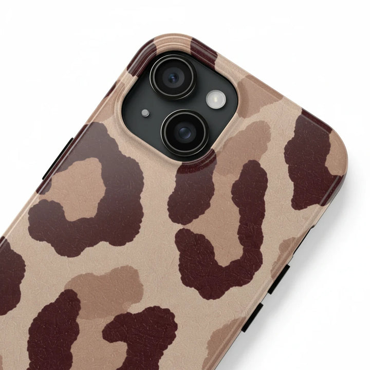Sunday Theory leopard print phone case with a glossy finish and brown animal pattern on a durable protective shell.