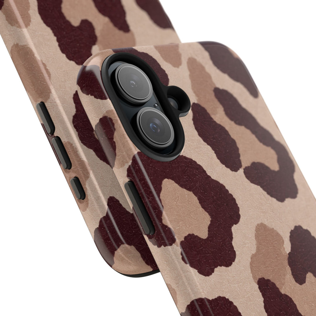 Sunday Theory leopard print phone case with glossy finish, brown animal pattern, and shock-absorbing TPU edges.