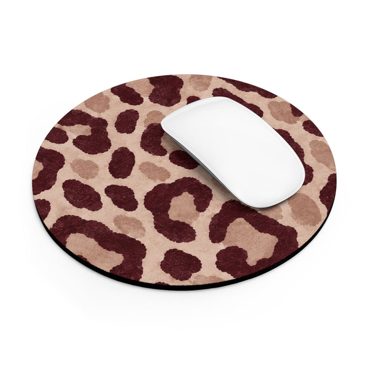Sunday Theory round neoprene mouse pad with a brown leopard animal print pattern and a white computer mouse on top