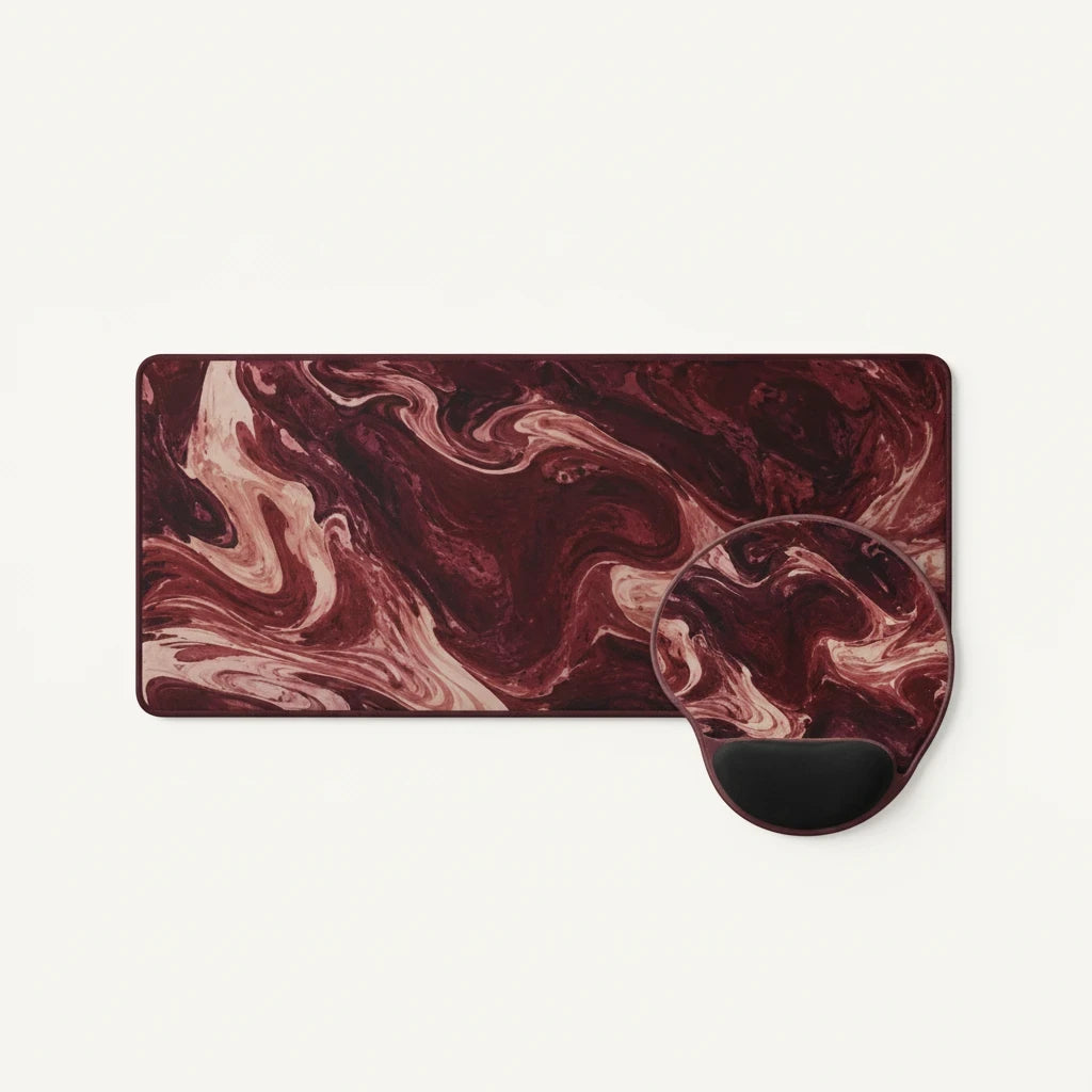 Sunday Theory maroon marble desk mat and ergonomic mouse pad with wrist rest featuring deep burgundy swirl patterns.