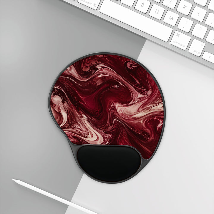 Sunday Theory maroon marble mouse pad with ergonomic black memory foam wrist rest on a desk next to a keyboard.